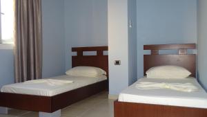 Postel nebo postele na pokoji v ubytování Hotel De Luna