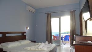 Postel nebo postele na pokoji v ubytování Hotel De Luna