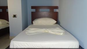 Postel nebo postele na pokoji v ubytování Hotel De Luna
