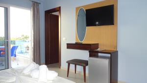 TV a/nebo společenská místnost v ubytování Hotel De Luna