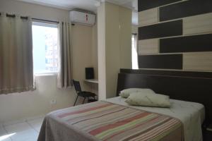 Postel nebo postele na pokoji v ubytování Hotel Calstar