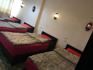 A bed or beds in a room at Wake Up! Cairo Hostel
