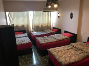 A bed or beds in a room at Wake Up! Cairo Hostel