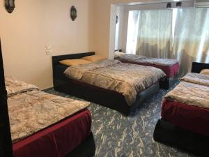 A bed or beds in a room at Wake Up! Cairo Hostel