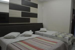 Postel nebo postele na pokoji v ubytování Hotel Calstar