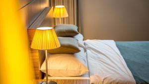 Postel nebo postele na pokoji v ubytování Venezia Hotel