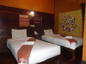 Postel nebo postele na pokoji v ubytování Baanfai Guesthouse Chiangkhong