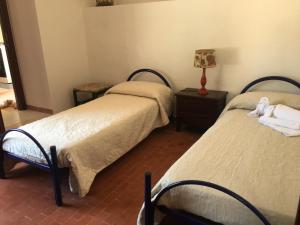 Letto o letti in una camera di Villino Fraginesi