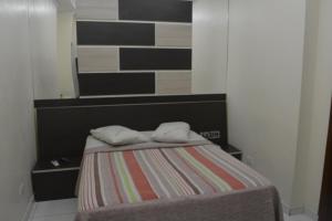 Postel nebo postele na pokoji v ubytování Hotel Calstar