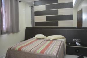 Postel nebo postele na pokoji v ubytování Hotel Calstar