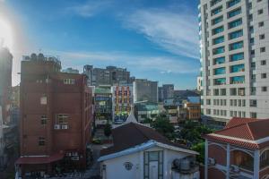 a view of a city with tall buildings at Gather in Tainan