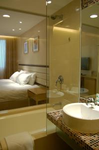 Voodi või voodid majutusasutuse Grandview Hotel Macau toas