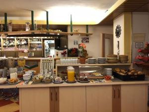 a kitchen with a counter with food on it at Tannenhof in Ehrwald