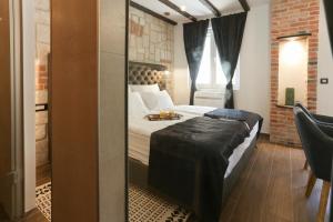 Postel nebo postele na pokoji v ubytování Luxury Rooms Dino