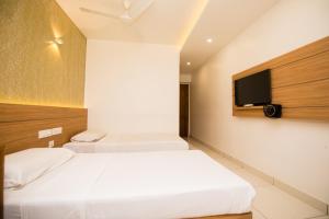 Hotel Kapilavasthu客房内的一张或多张床位