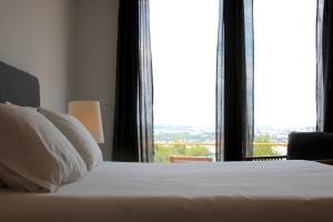 Кровать или кровати в номере Quinta Tagus