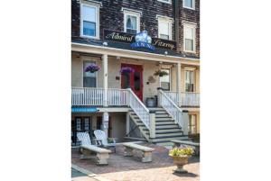 a building with stairs and benches in front of it at Admiral Fitzroy Inn in Newport