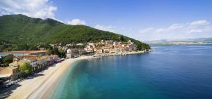 an aerial view of a town on a beach in the water at Apartment Luka in Matulji