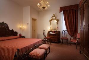 Tempat tidur dalam kamar di Hotel La Residenza