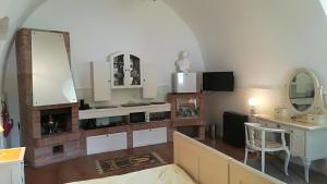 a living room with a table and a mirror at Gothic House Apartments in Kremnica