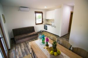 a living room with a table and a couch at Villa Sabina in Lohovo