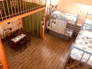an overhead view of a room with a table and bunk beds at Danista Nomads Tour Hostel in Ulaanbaatar