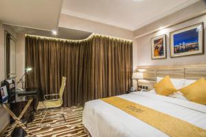 Voodi või voodid majutusasutuse Metropark Hotel Macau toas