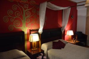 Postel nebo postele na pokoji v ubytování Hotel Electra