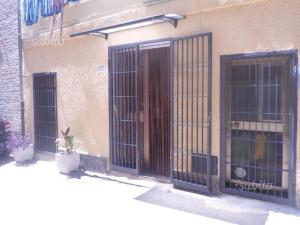 a building with two gates on the side of it at Da Venere in Vasto