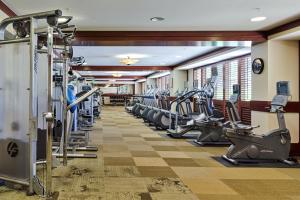 a gym with rows of treadmills and machines at Popular Ground Floor with Extra Grassy Area - Beach Tower at Ko Olina Beach Villas Resort in Kapolei