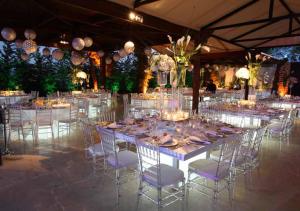 a dining room with a table and chairs and lights at Printania Palace Hotel in Broummana