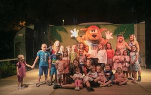 a group of children posing for a picture on a stage at Hotel Continental in Senigallia +102 photos