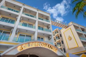 a building with a sign for golden cranes at Golden Orange Hotel in Antalya