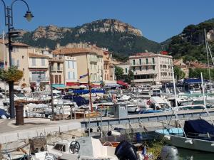 a bunch of boats are docked in a harbor at Mini Loft in Cassis