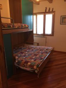 Кровать или кровати в номере Capannina Vesale