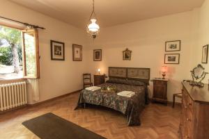 Postel nebo postele na pokoji v ubytování La Villa di Torraiolo