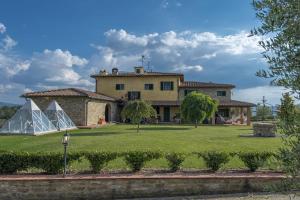 a house with a tent in front of it at Savernano in Reggello