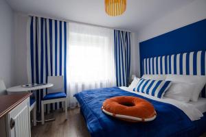 Postel nebo postele na pokoji v ubytování Pokoje Gościnne Hafen Guesthouse - Władysławowo