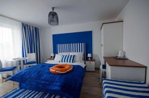 Postel nebo postele na pokoji v ubytování Pokoje Gościnne Hafen Guesthouse - Władysławowo