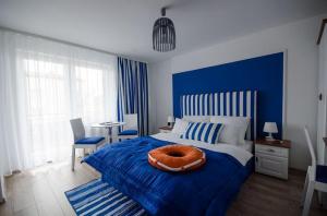 Postel nebo postele na pokoji v ubytování Pokoje Gościnne Hafen Guesthouse - Władysławowo