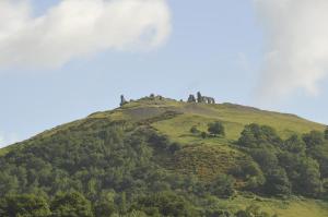 a hill with a castle on top of it at Greenbank Lodge LLANGOLLEN in Llangollen