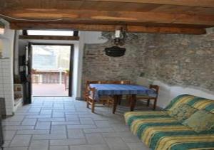 a living room with a couch and a table at Grottino Apartment in San Potito