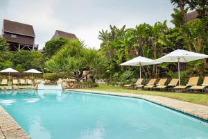 The swimming pool at or close to First Group Kowie River Chalets