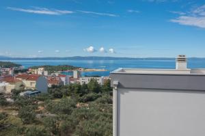 a view of the ocean from the roof of a building at Holiday Home Ivan in Makarska