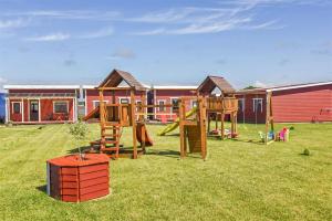 a yard with a playground with a play set at Ardonas in Šventoji
