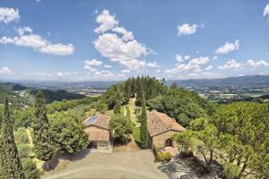 an aerial view of a house in the hills at Podere Capitignano in Borgo San Lorenzo