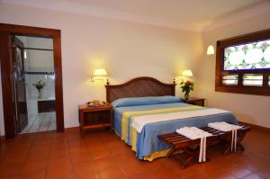 Letto o letti in una camera di The Lodge At Uxmal