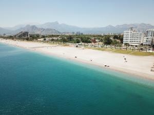 an aerial view of a beach and the ocean at Acropol Beach Hotel in Antalya