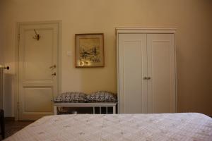 a bedroom with a bed and a picture on the wall at Rooms by Anna Affittacamere in Florence