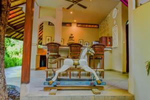 a house with a statue of a horse on a table at Ben Bali Villa in Seminyak